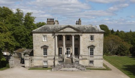 Constable Burton Hall by D'Arcy Wyvill Photograph of country house with steps up to entrance and woodland behind